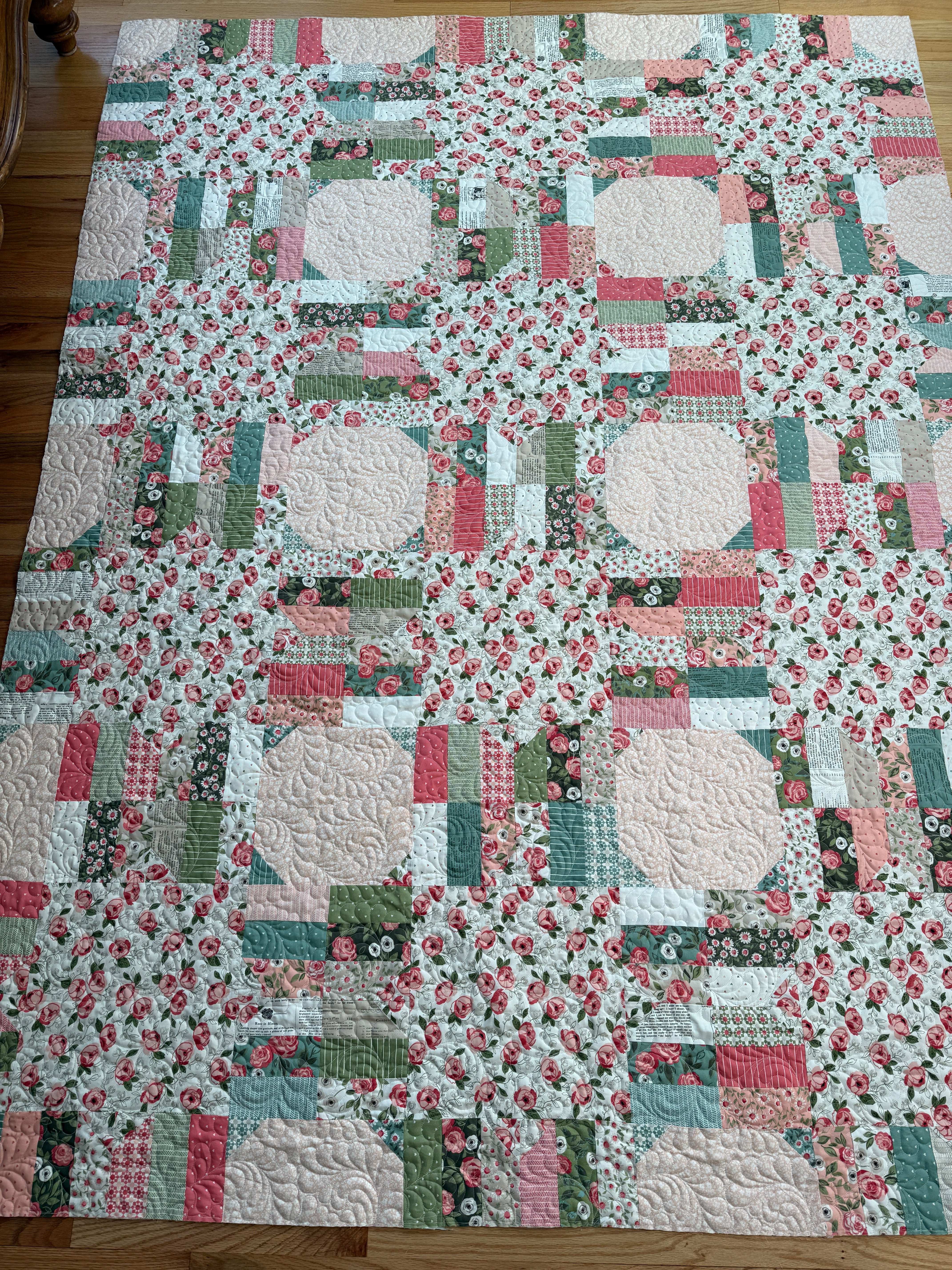 Project Jelly Roll Kit Luster Quilt featuring Lovestruck floral fabric in pink, green, and cream colors, 65 x 86.5 inches