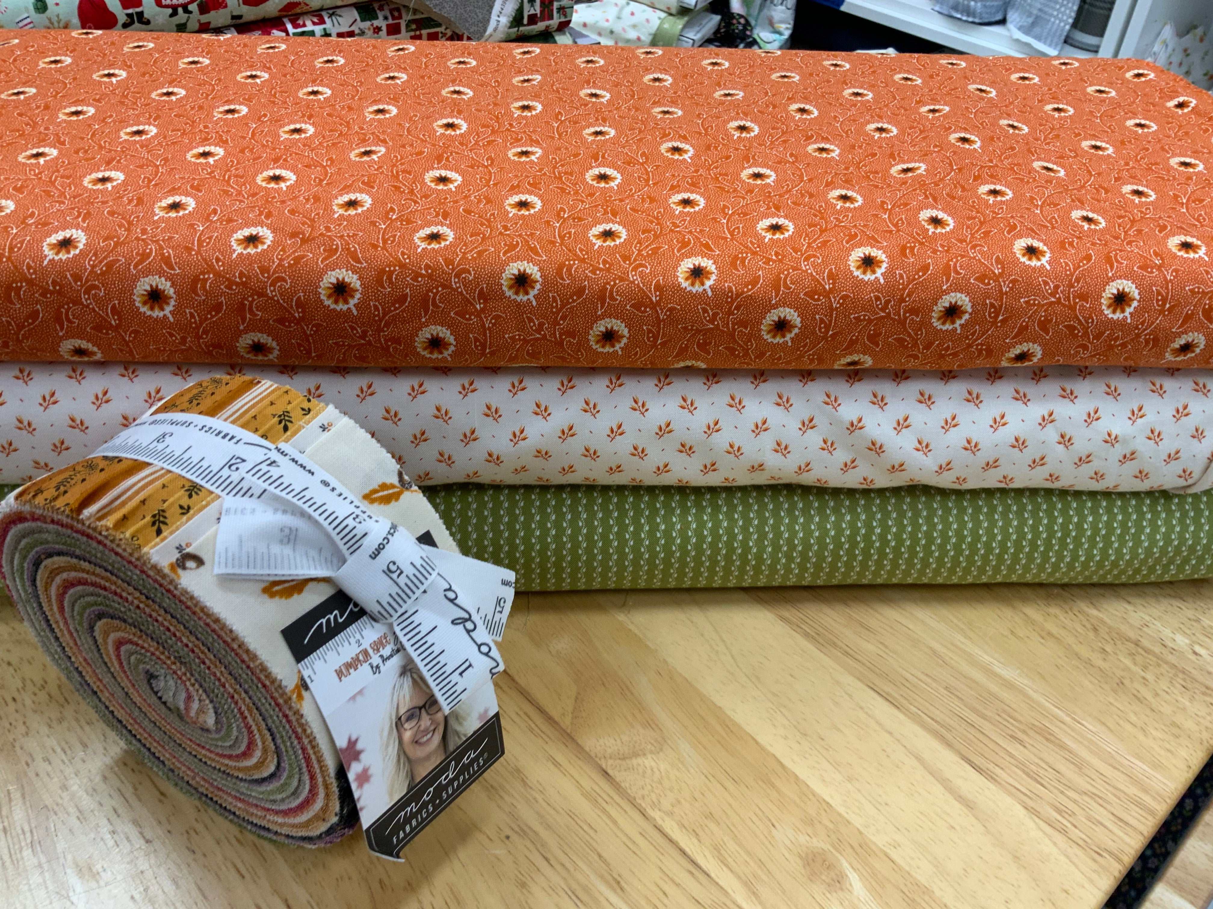 Project Jelly Roll Kit with Pumpkin Spice fabric and coordinating prints for Luster quilt pattern