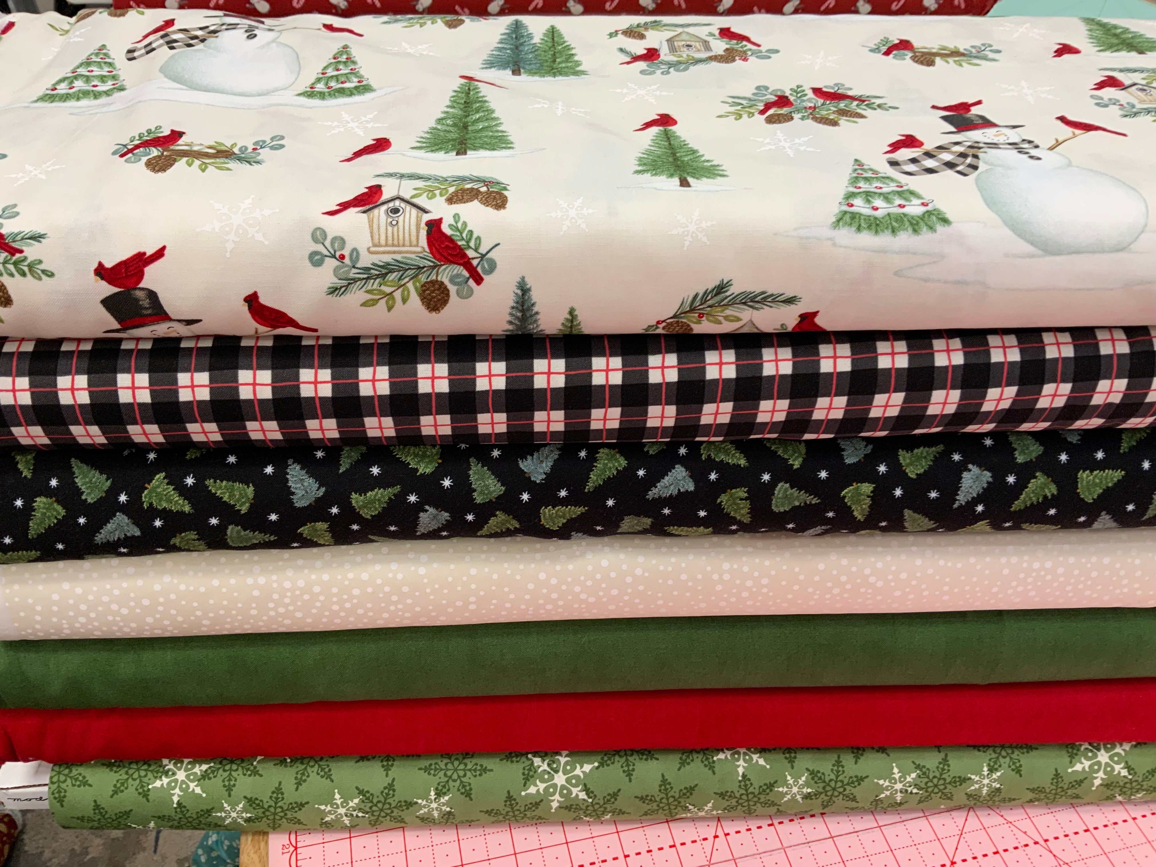 M50 Island Hopping Kit Christmas and winter themed quilting fabrics stacked