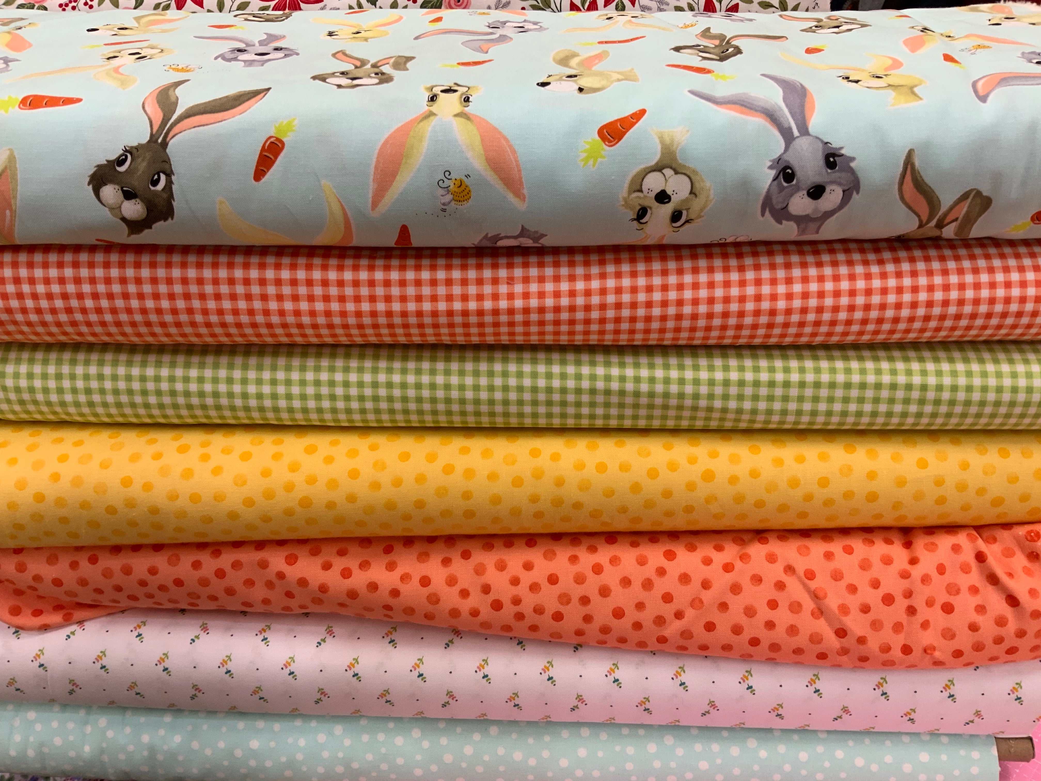 M50 Island Hopping Kit colorful fabric stack with bunny and polka dot patterns for quilting