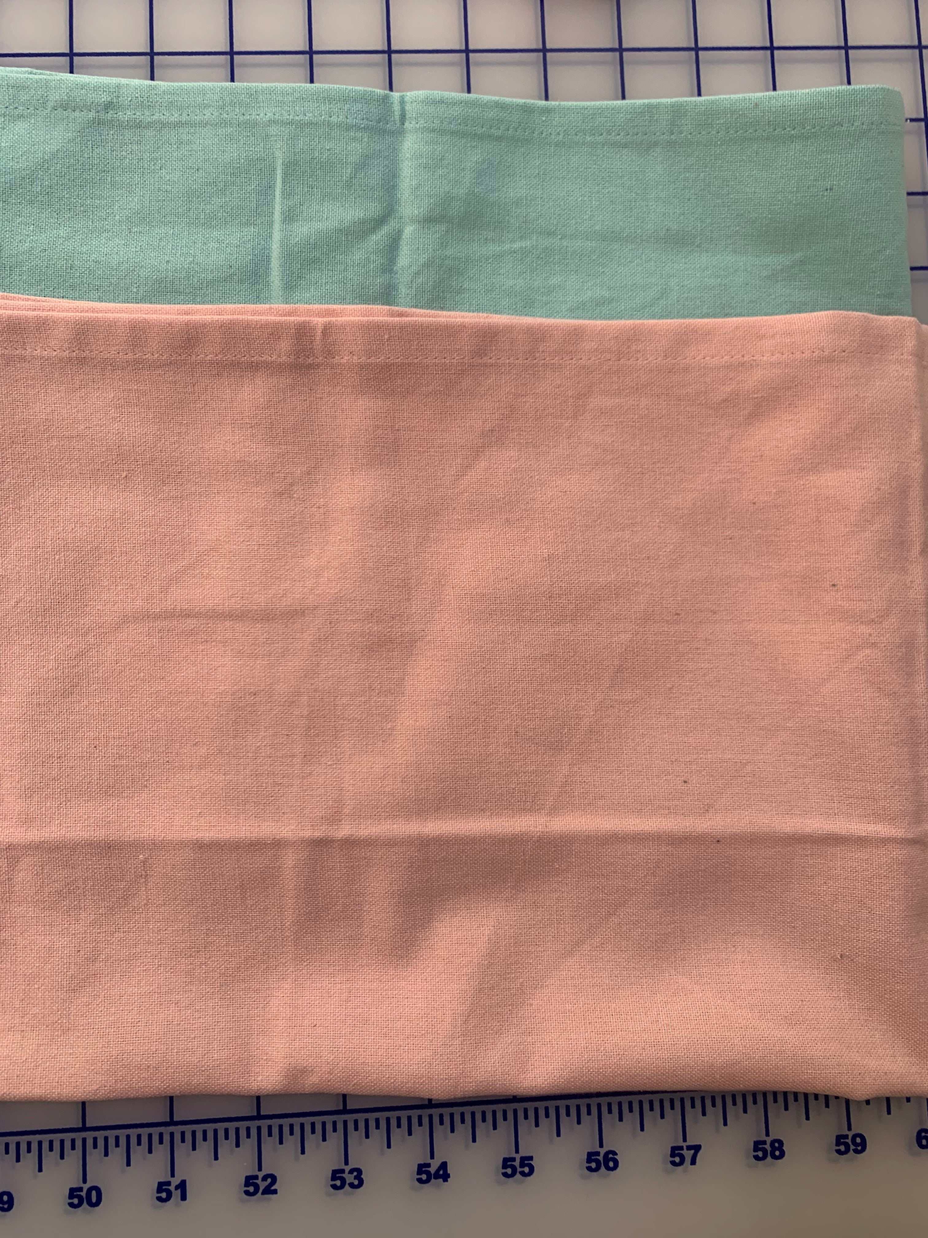 Solid flat weave kitchen towels in pale pink and pale aqua colors, 100% cotton, ideal for embroidery embellishment