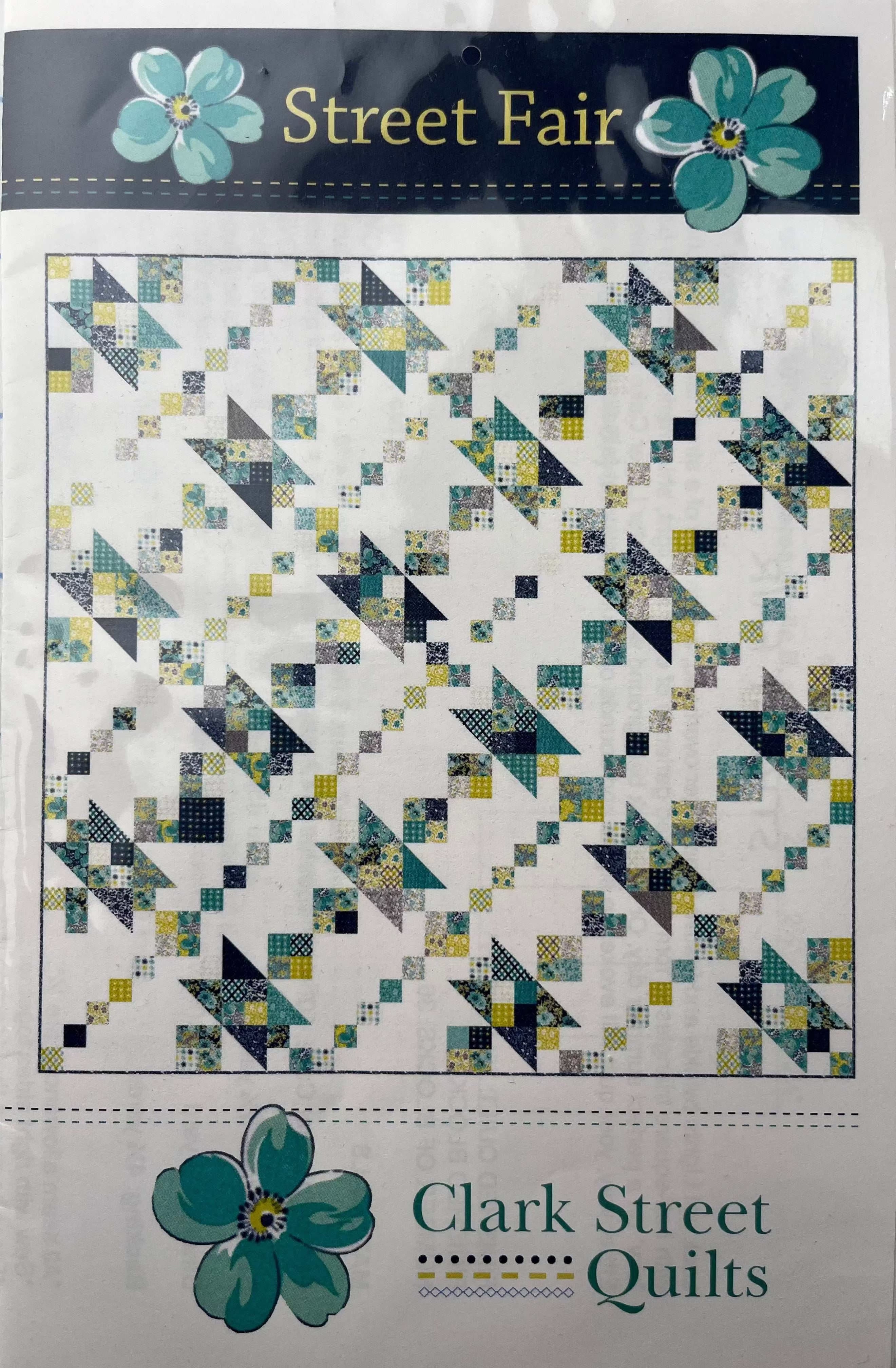 Street Fair quilt pattern by Clark Street Quilts with blue and green patchwork design