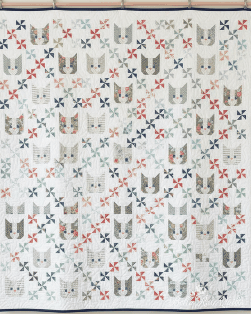 Kittens Quilt Kit featuring cat faces and pinwheel patterns in soft colors, 74x74 inches quilt top kit by Camille Roskelley