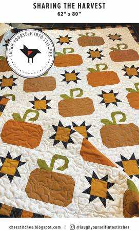 Sharing the Harvest autumn quilt with pumpkin and star blocks measuring 62 by 80 inches