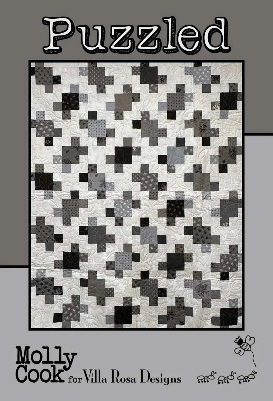 Black and white Puzzled Pattern quilt by Molly Cook from Villa Rosa Designs with 80 five-inch squares and finished size 50 by 62 inches