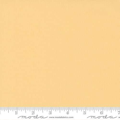 Moda Bella Solid yellow fabric half-yard increments with ruler trim