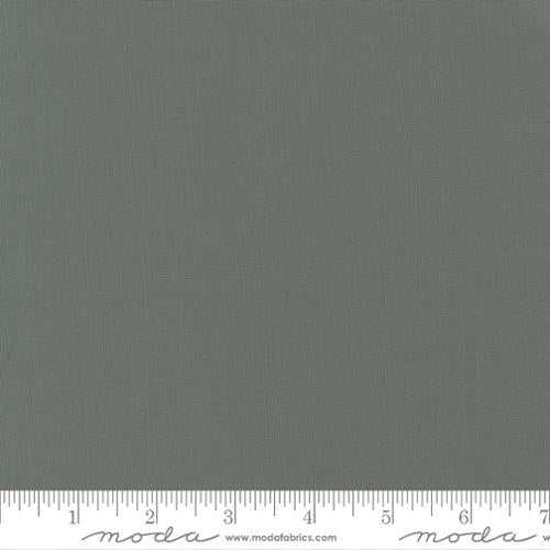 Moda Bella Solid fabric in Etchings Slate color with ruler for measurement