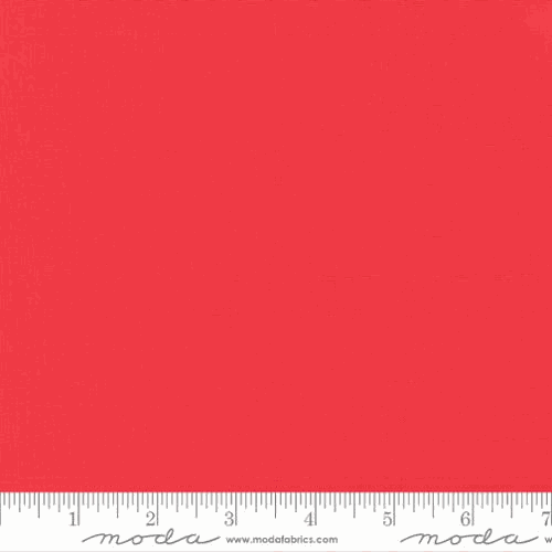 Bella Solids from Moda 9900 258 Geranium fabric half yard with ruler for scale
