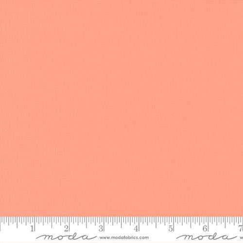 Moda Bella Solid fabric in Peach Blossom color with ruler for measurement