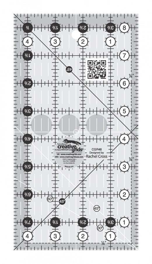 Creative Grids Ruler 4-1/2 x 8-1/2 with black and white 1-inch grid markings, 45-degree angles, and non-slip grip for quilting and fabric cutting.