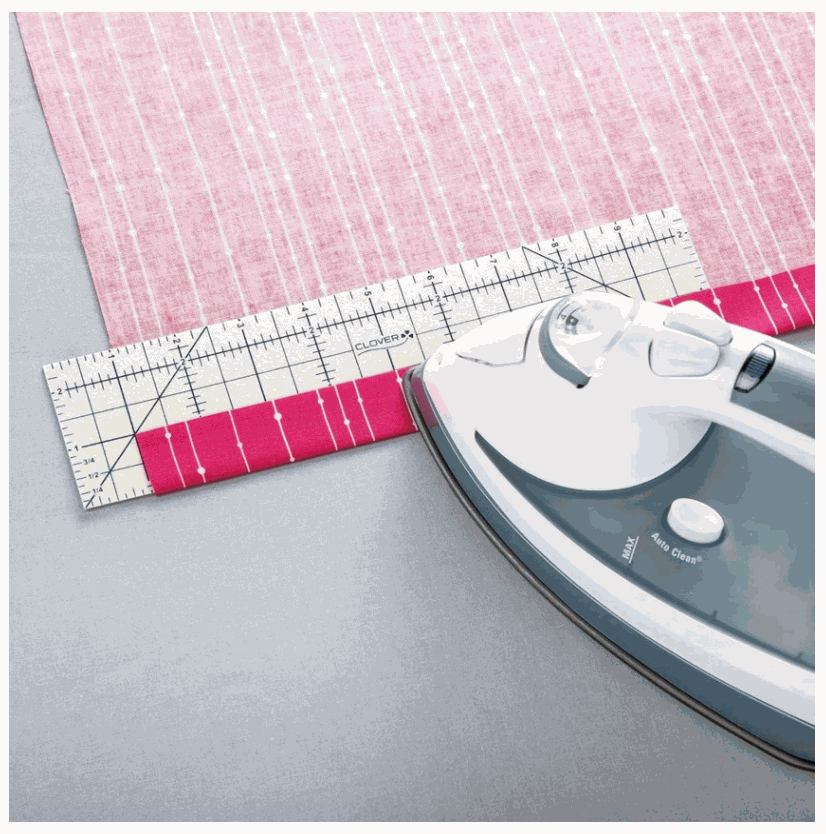 Hot Ruler with fabric and iron for precise measuring and pressing hems
