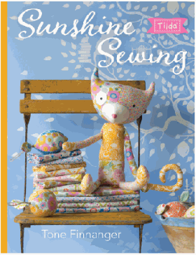 Sunshine Sewing book by Tone Finnanger showcasing summer sewing projects with colorful quilts and fabric decorations