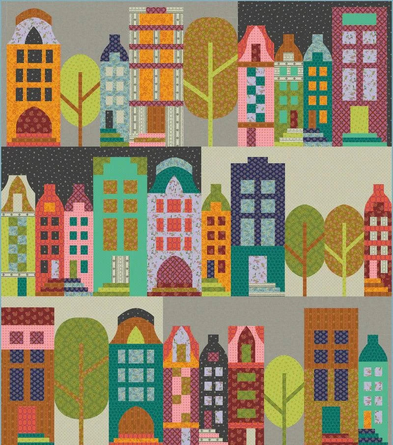 Park Place Quilt Kit colorful quilt top with vintage cloth cityscape design and trees.