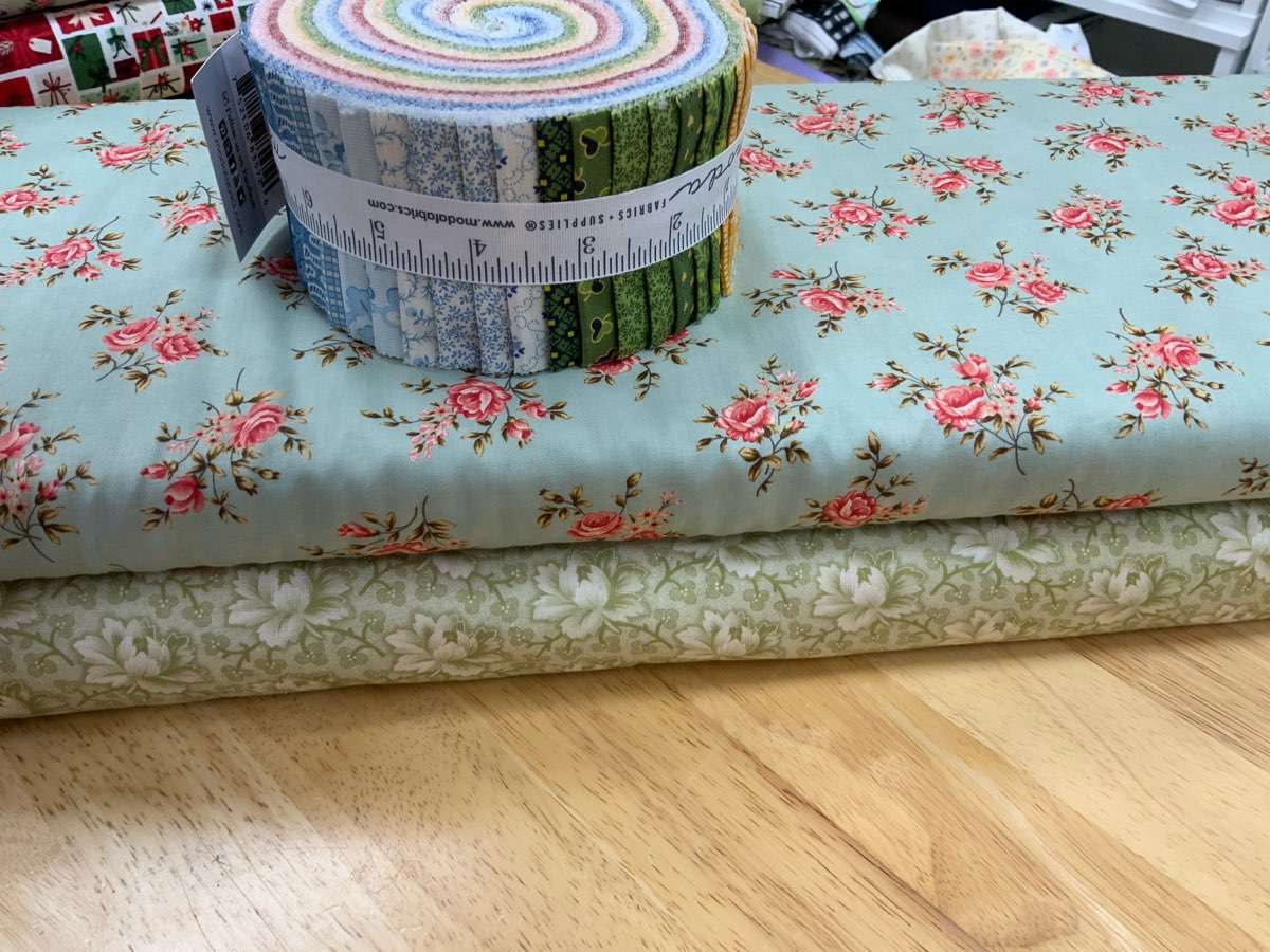 Project Jelly Roll Kit with floral fabric and colorful fabric roll for Shift quilt by Betsy Chutchian
