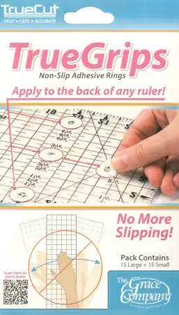 TrueGrips non-slip adhesive rings on rulers by TrueCut for safe and accurate cutting