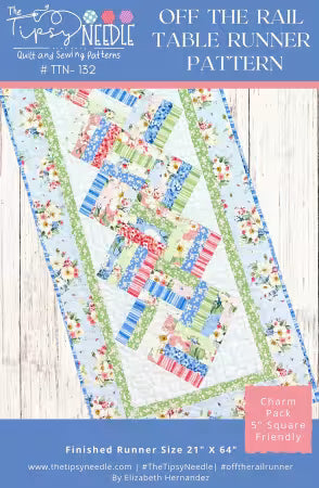Off the Rail Table Runner quilt pattern by Elizabeth Hernandez featuring colorful charm pack squares on a wooden background