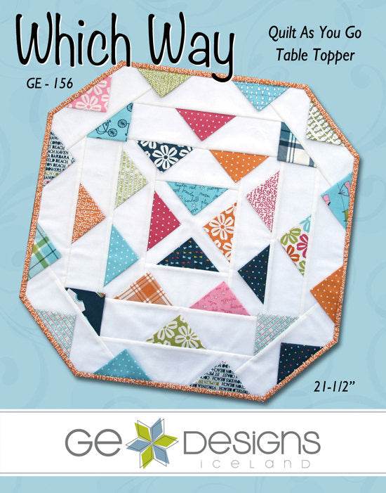 Which Way Table Topper quilt pattern made with Charm Pack and background fabric measuring 21-1/2 inches