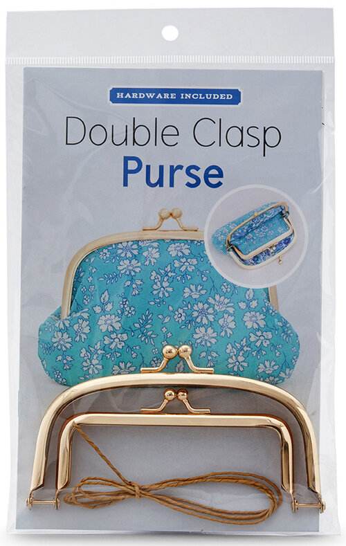 Double clasp purse kit with rose gold metal frame and floral fabric pattern.