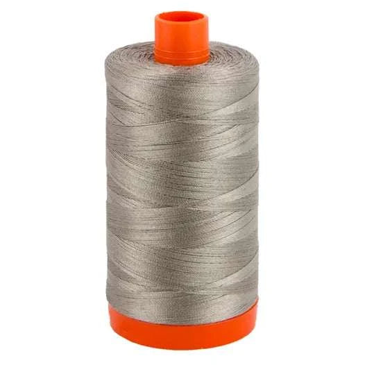 Aurifil 50wt cotton thread spool in earl grey color for quilting and sewing