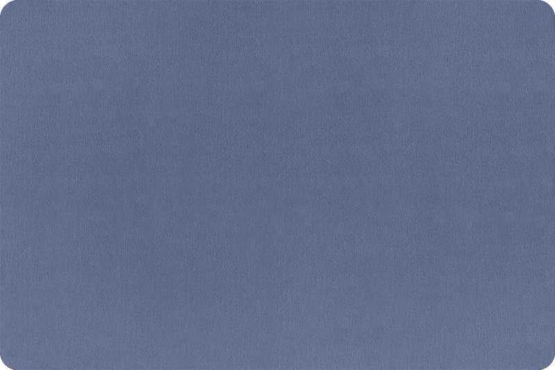 Solid Cuddle 3 plush minky fabric in jeans blue by Shannon Fabrics, ultra-soft and durable polyester material sold by half-yard increments.