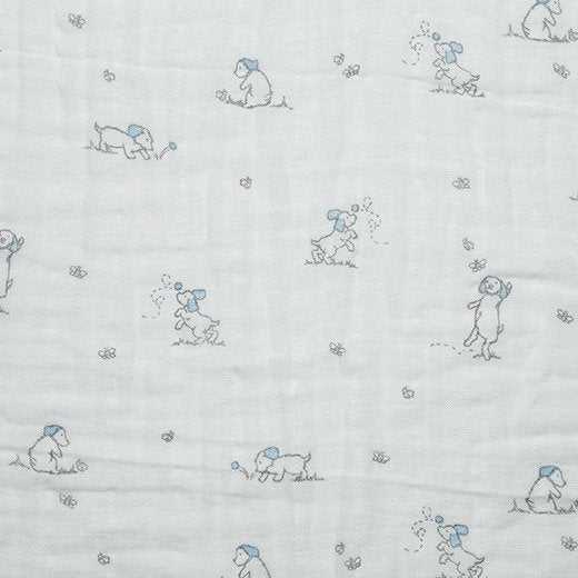 Embrace® Double Gauze Cotton fabric with blue puppy print on white background by Shannon Fabrics