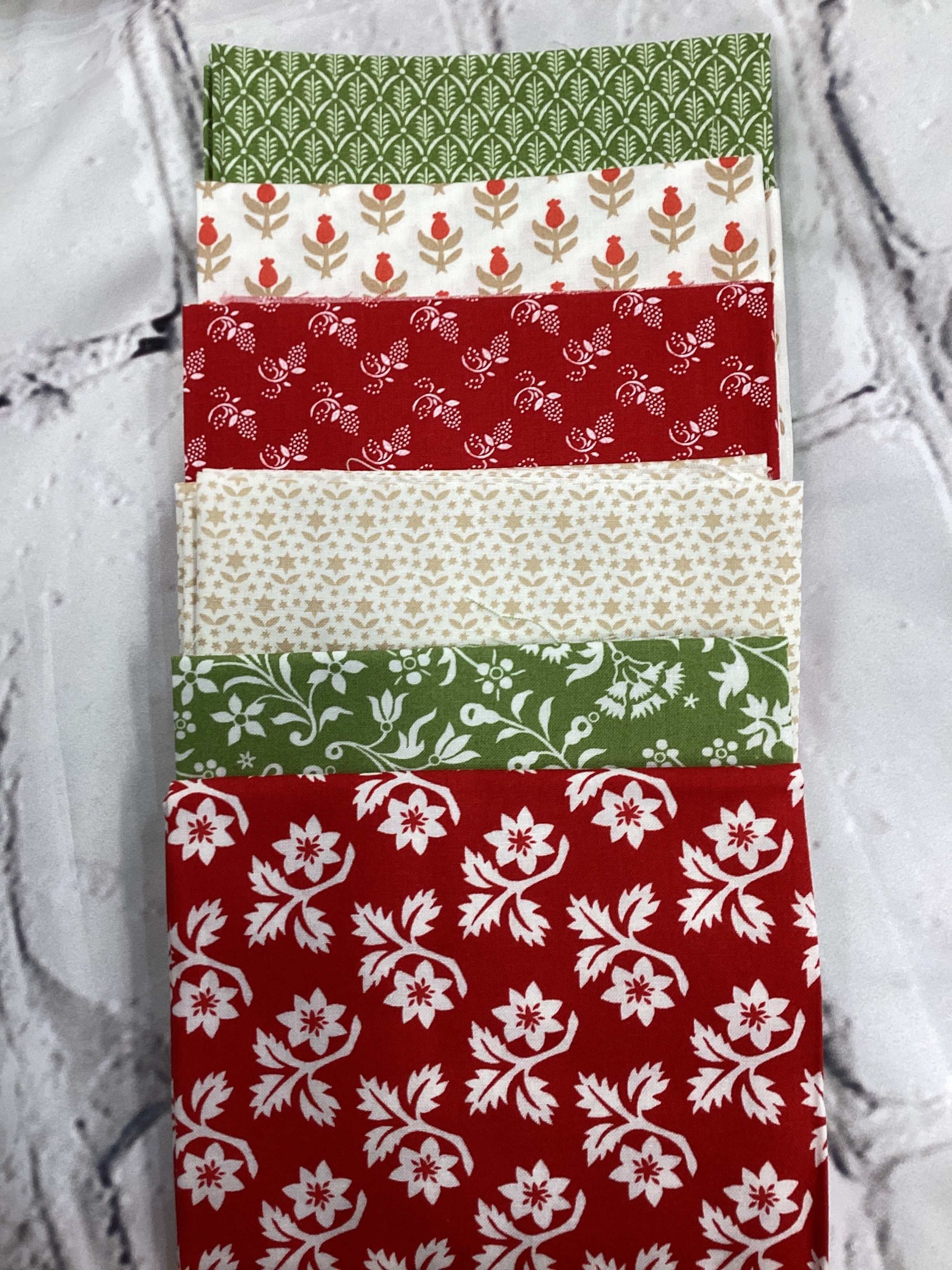 M50 Starry Night Bundle with floral and geometric patterned fabric pieces in green, red, and cream colors