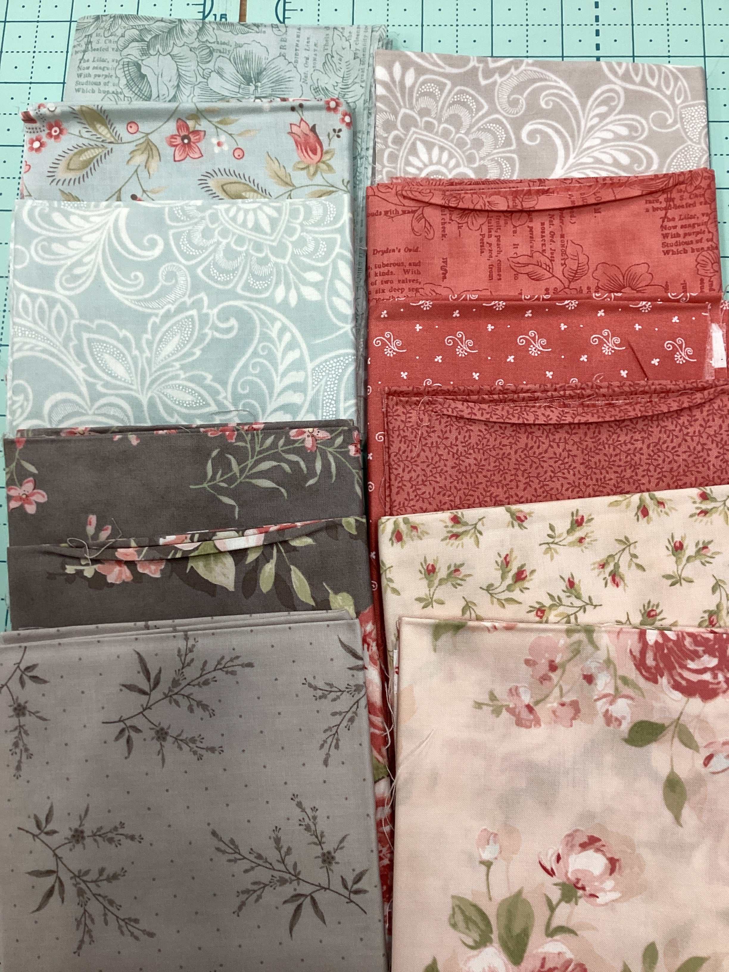12-piece Fat Quarter Bundle curated by Bella Rose Quilts with floral and patterned fabrics
