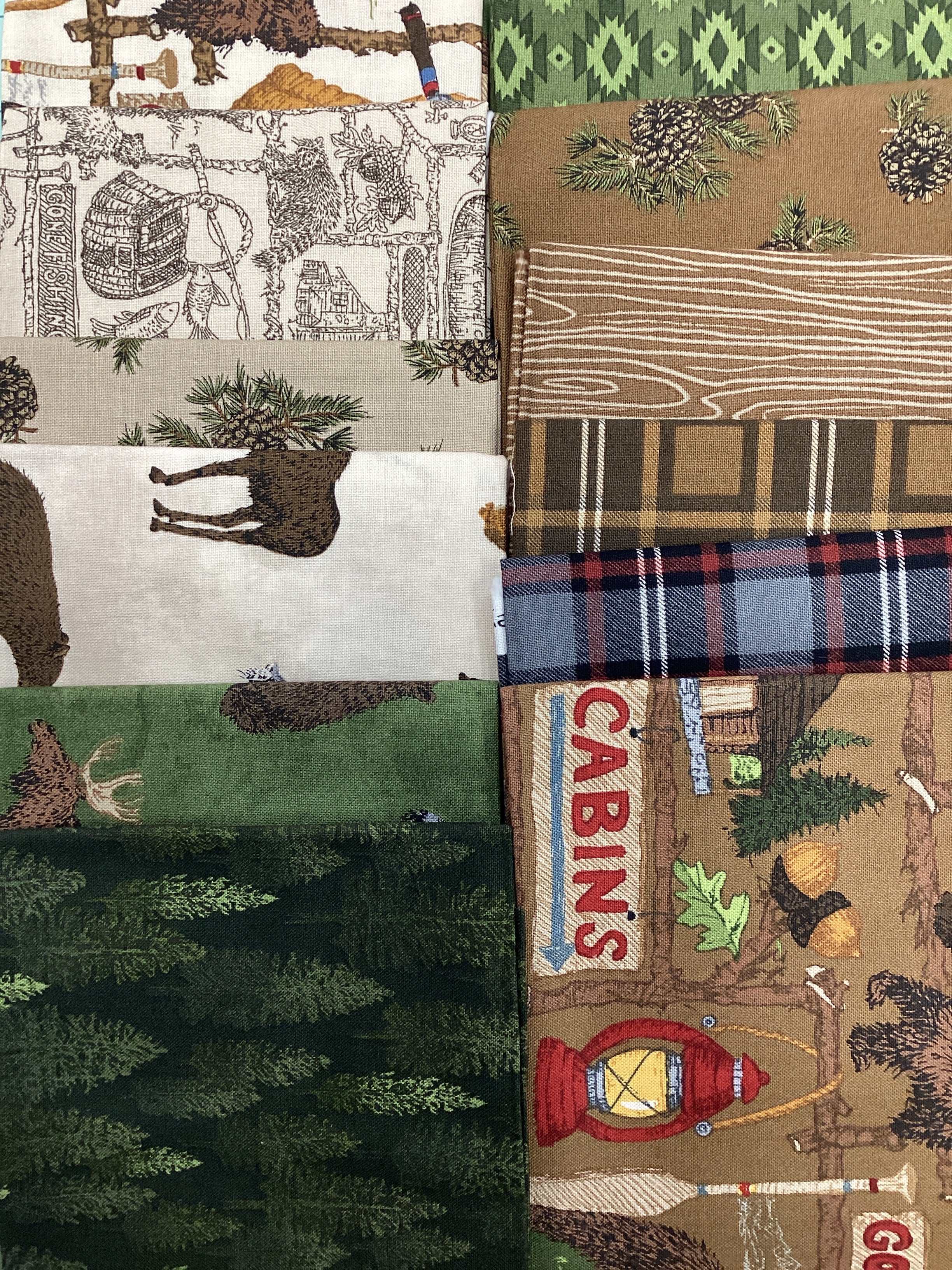 12-piece Fat Quarter Bundle curated by Bella Rose Quilts with woodland and cabin-themed fabrics