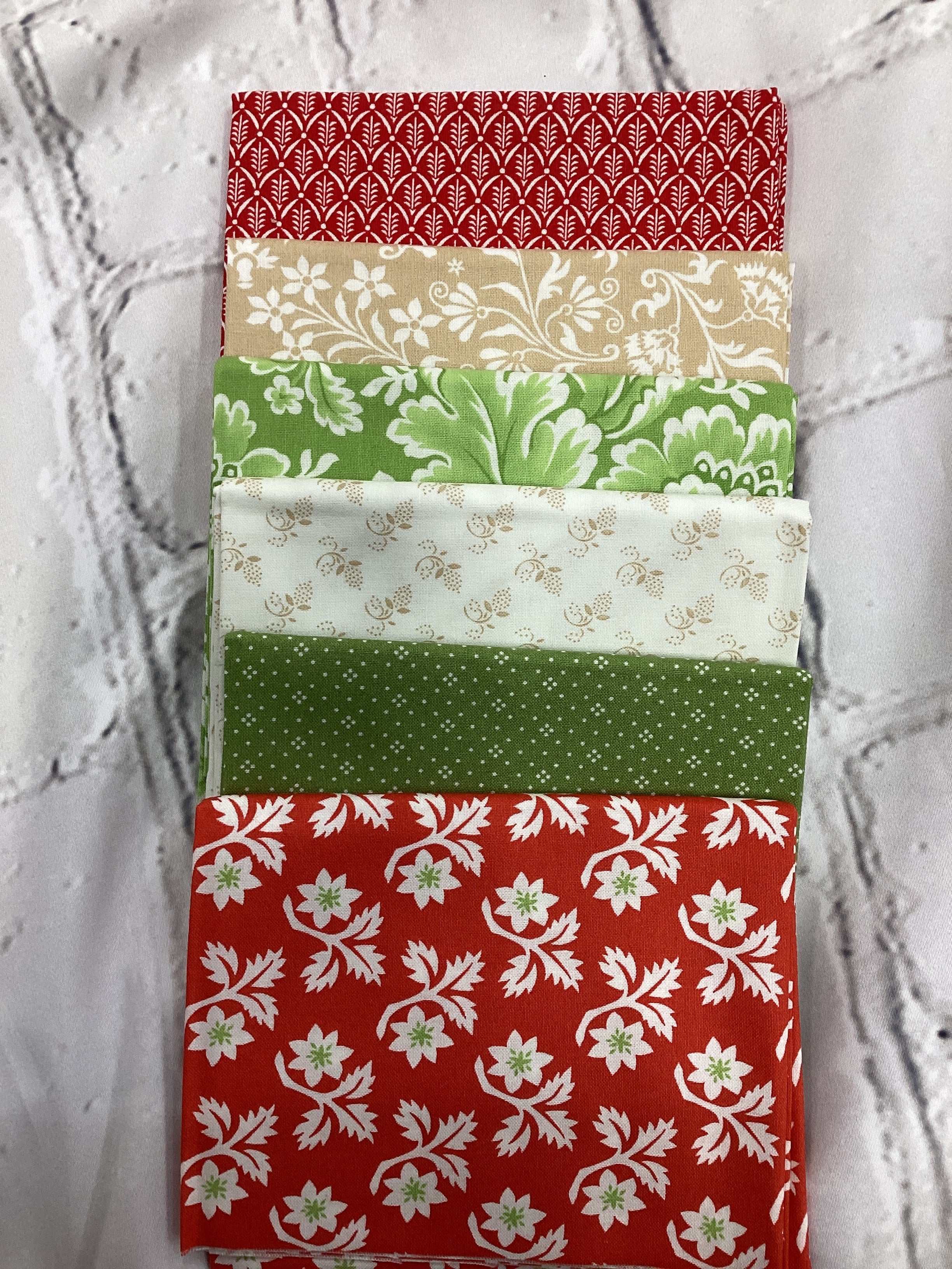 M50 Starry Night Bundle fabric collection with red, green, and beige floral patterns curated by Bella Rose Quilts