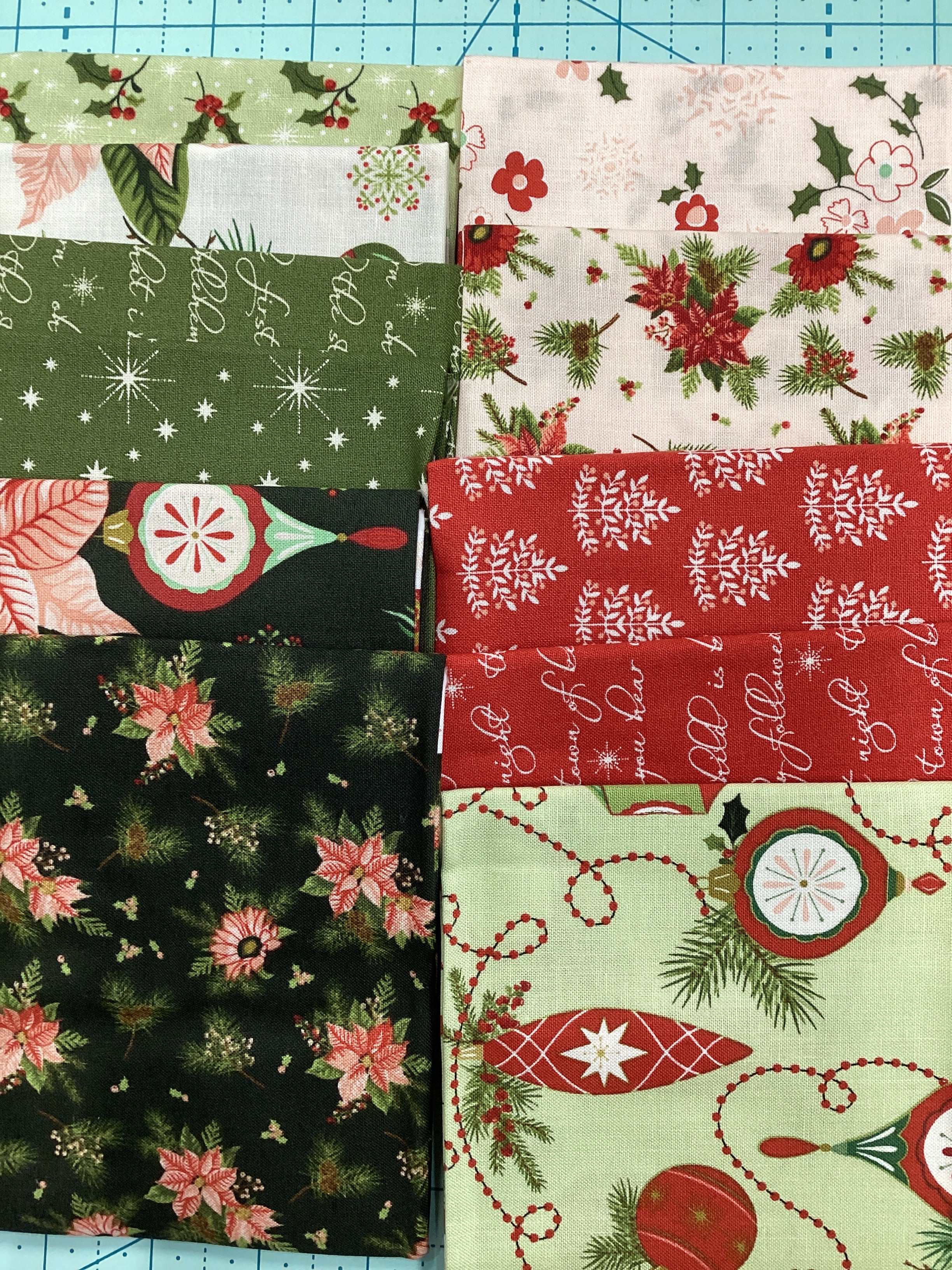 12 piece Fat Quarter Bundle with Christmas-themed fabric curated by Bella Rose Quilts