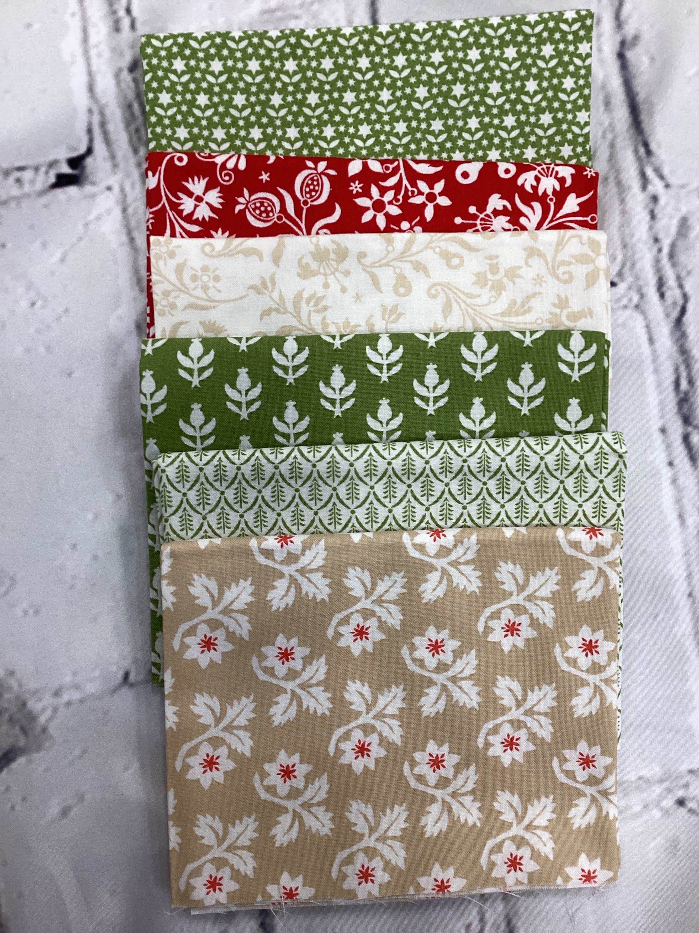 M50 Starry Night fabric bundle with green, red, cream, and beige floral patterns curated by Bella Rose Quilts