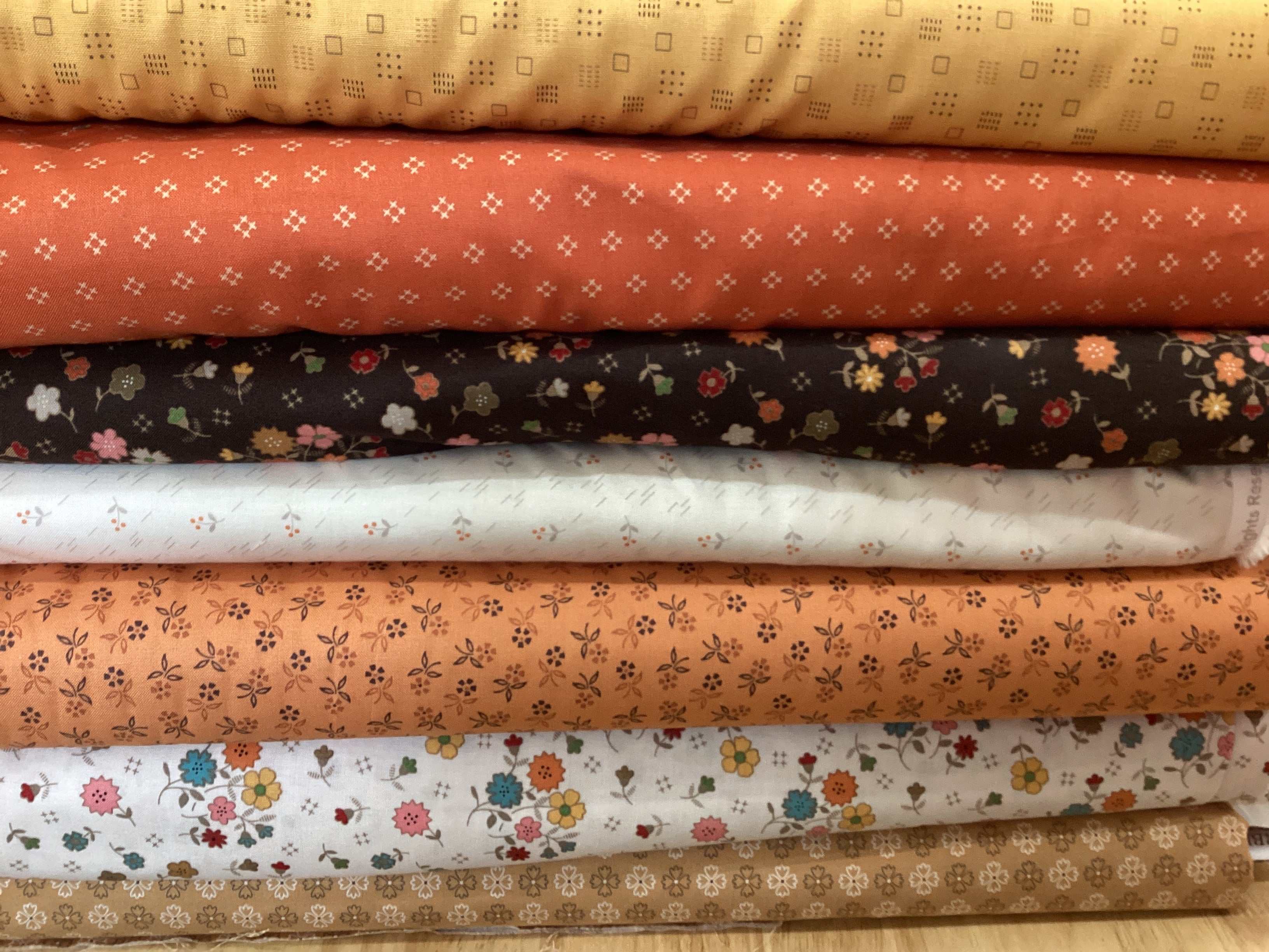M50 Island Hopping Kit fabric bundle curated by Bella Rose Quilts with floral and geometric patterns