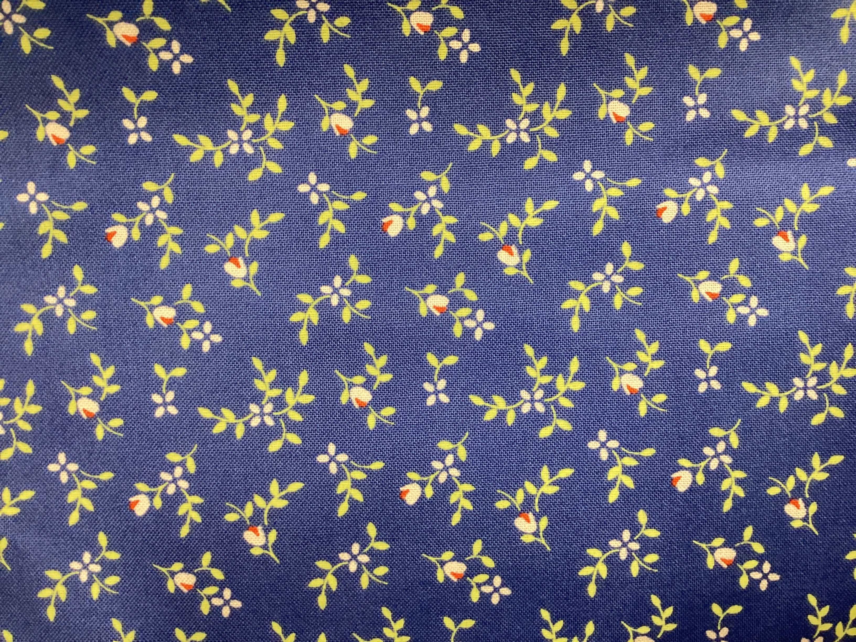 3 Yard Backing fabric with small yellow and orange floral pattern on blue background for quilt backings