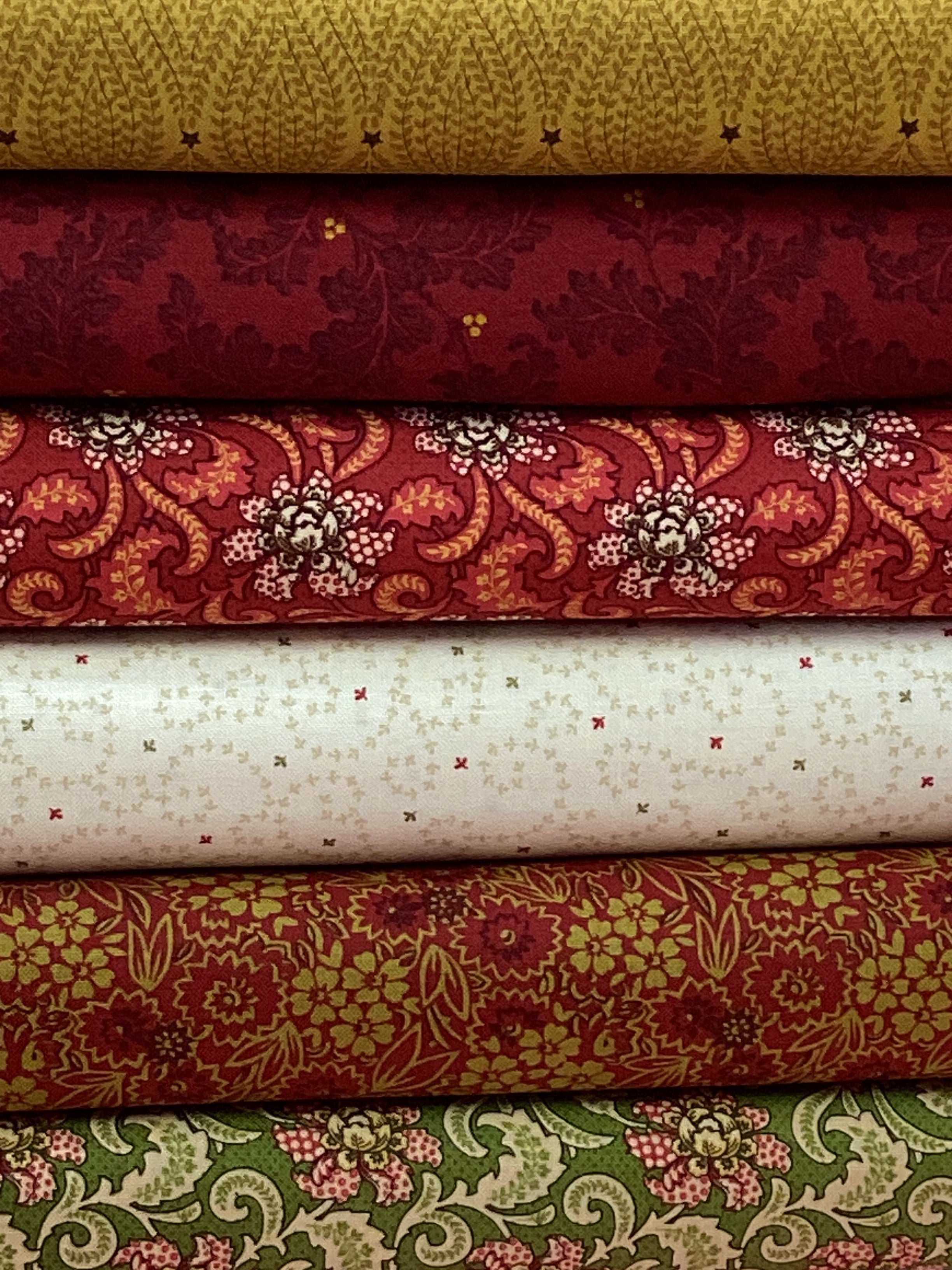 M50 Starry Night fabric bundle featuring assorted floral and patterned quilting fabrics curated by Bella Rose Quilts