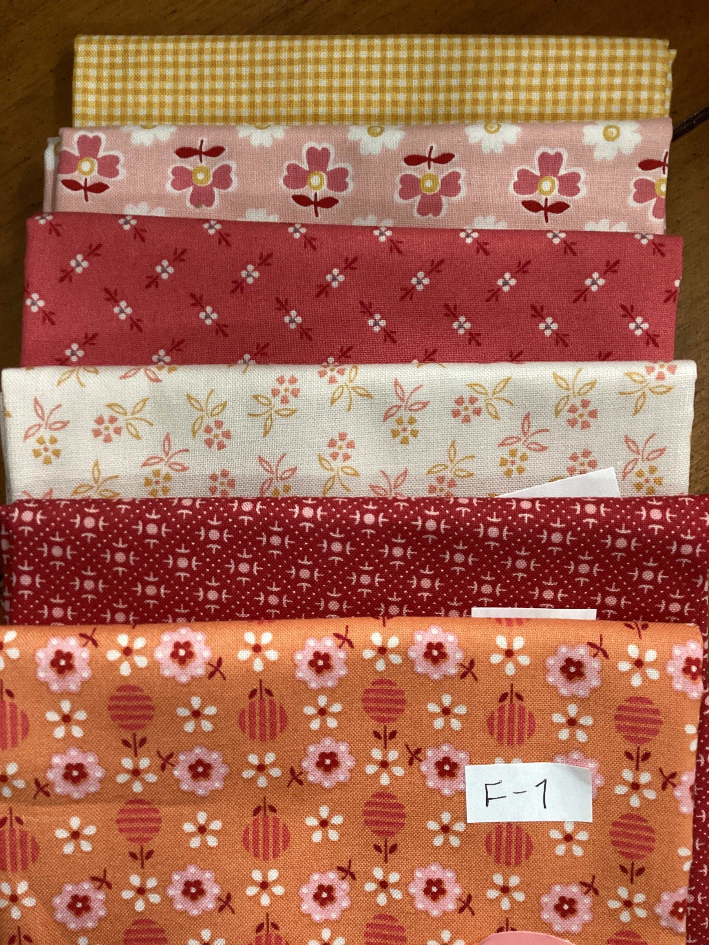 M50 Bella Rose Quilts starry fat quarter bundle with floral and patterned fabrics in red, pink, yellow, and white colors