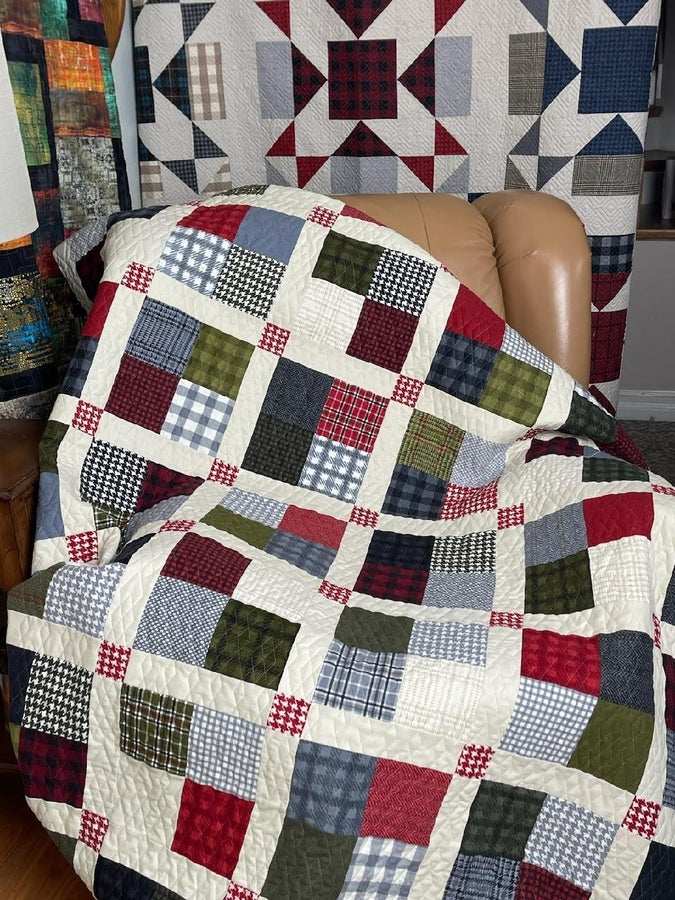 Sew Simple Quilt Kit featuring plaid and solid flannel patchwork quilt draped on chair