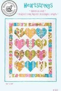 Heartstrings Quilt Pattern featuring colorful hearts made from jelly roll strips, 56x68 inches, quick and easy design by Black Mountain Needleworks