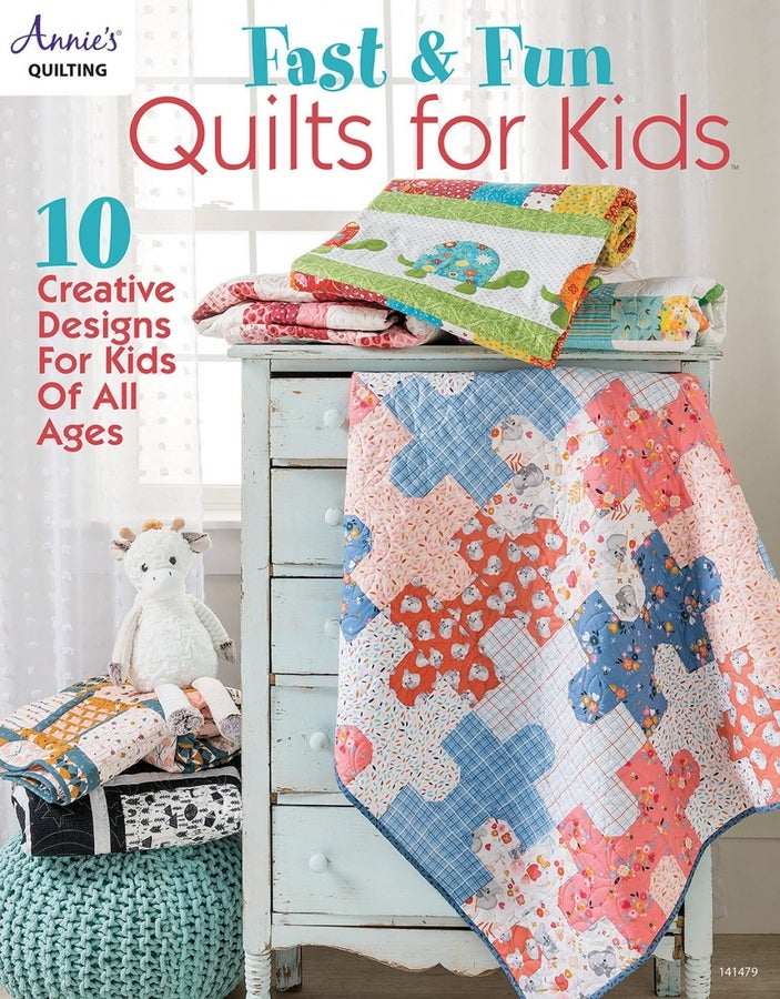 Colorful handmade quilts for kids displayed on a dresser promoting fast and fun quilt designs for all ages