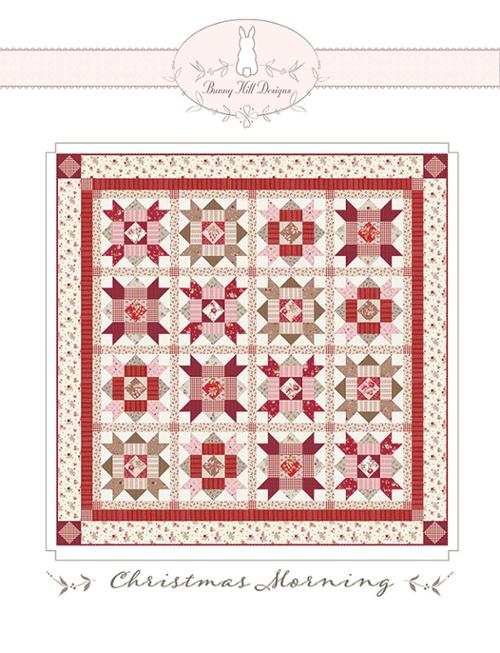 PATTERN Christmas Morning quilt design by Anne Sutton with red and beige star blocks and floral borders