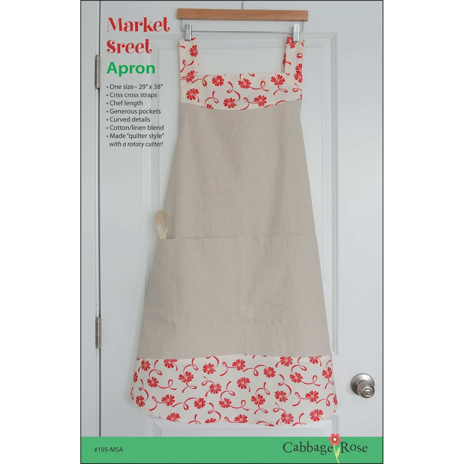 Market Street Apron with red floral print, beige cotton linen blend, cross straps, and pockets, 29 by 38 inches