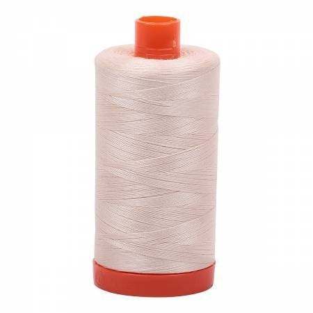 Aurifil 50wt Cotton Thread spool in light sand color for sewing and quilting