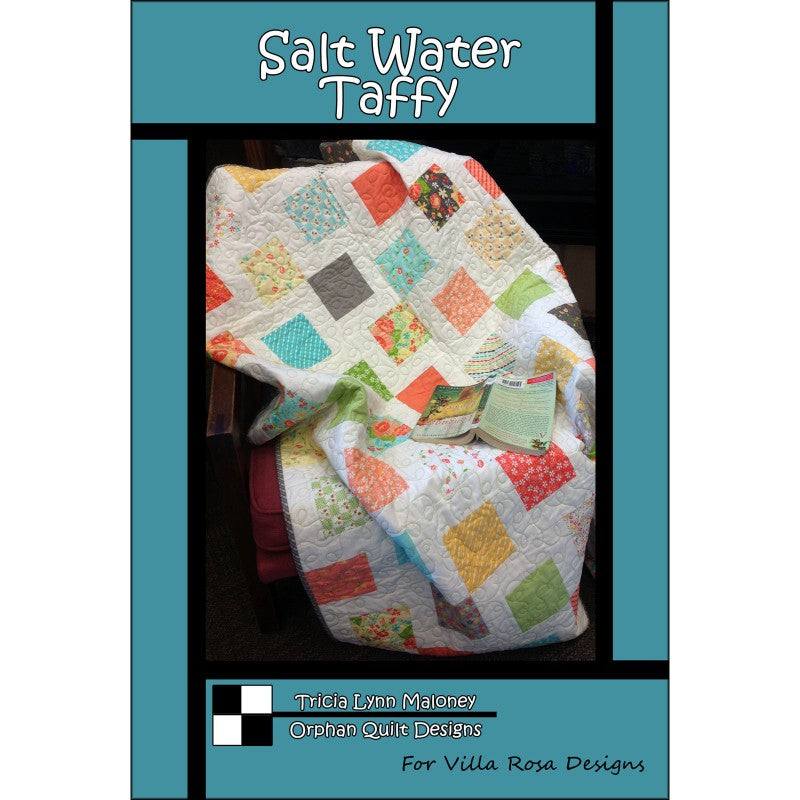 Salt Water Taffy quilt pattern by Tricia Lynn Maloney featuring colorful charm squares on a white background