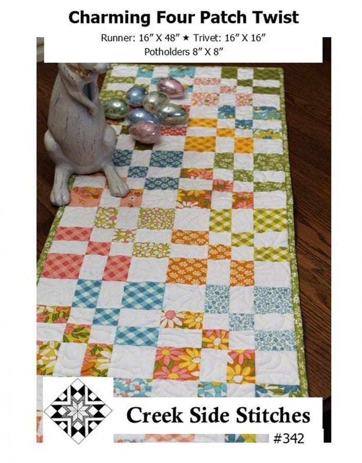 Charming Four Patch Twist quilted table runner and matching trivet with colorful patchwork squares by Creek Side Stitches