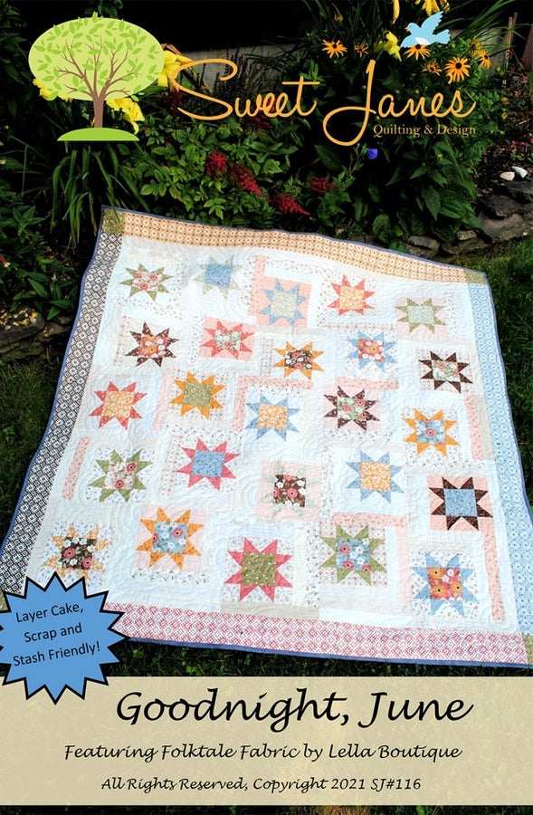 Sweet Jane's Quilting & Design Goodnight June star pattern quilt with folk art fabric and low volume background.