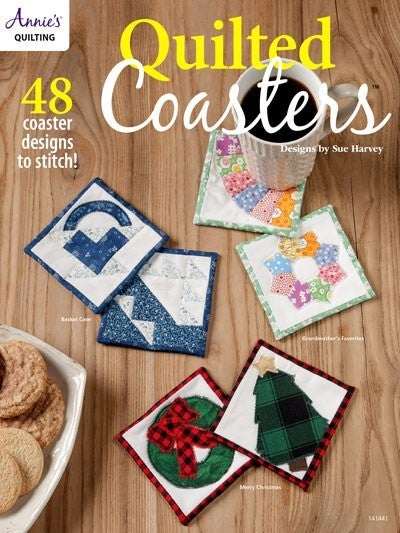 Set of colorful quilted coasters with various patterns and festive holiday designs on a wooden surface