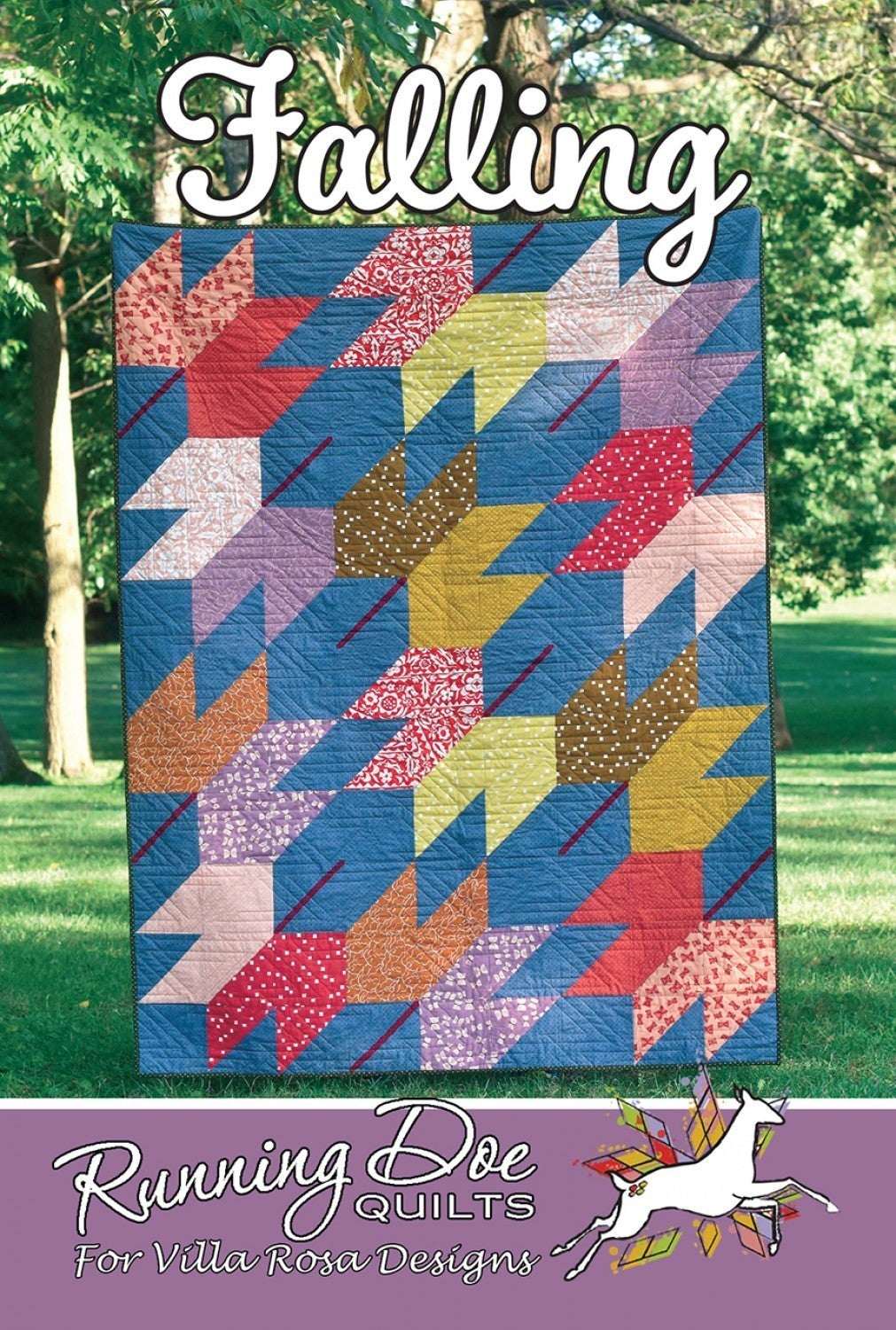 Colorful Falling quilt pattern by Villa Rosa Designs displayed outdoors