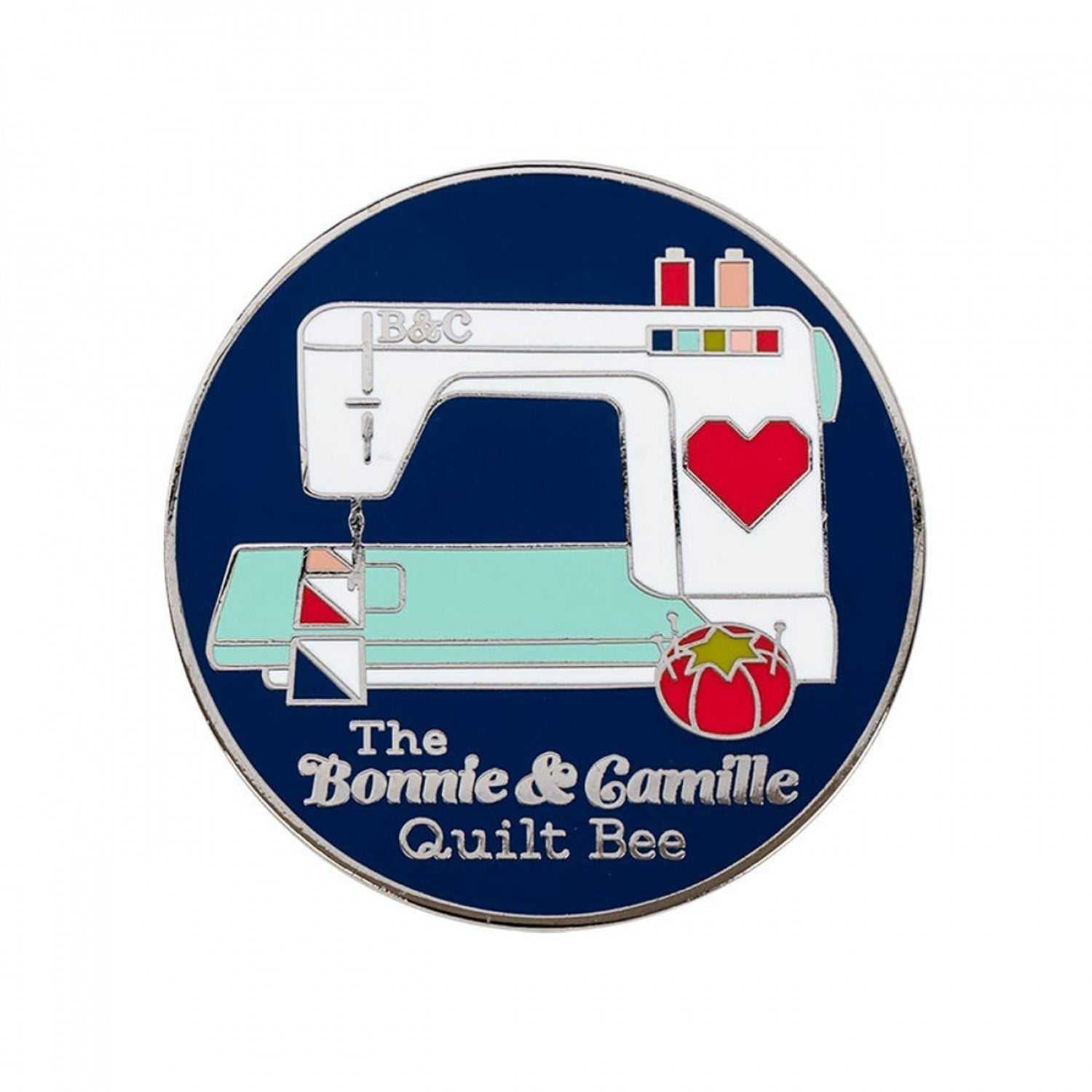 Sewing with Bonnie & Camille enamel needle minder featuring sewing machine design and The Bonnie & Camille Quilt Bee text