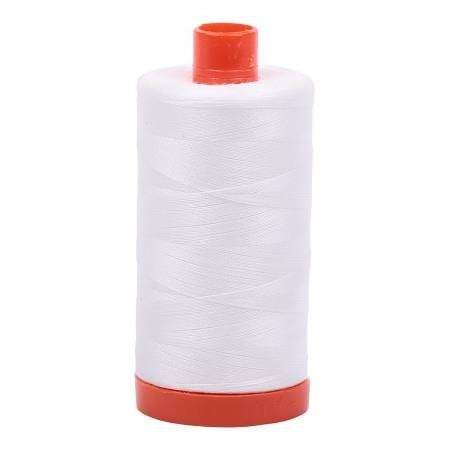 Aurifil 50wt cotton thread spool in natural white for quilting and sewing projects