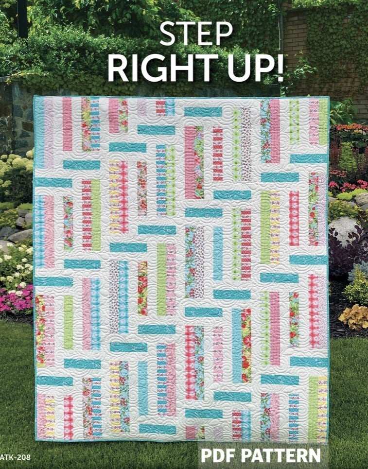 Step Right Up! Pattern quilt by Atkinson Designs with colorful rectangular blocks on white background outdoors