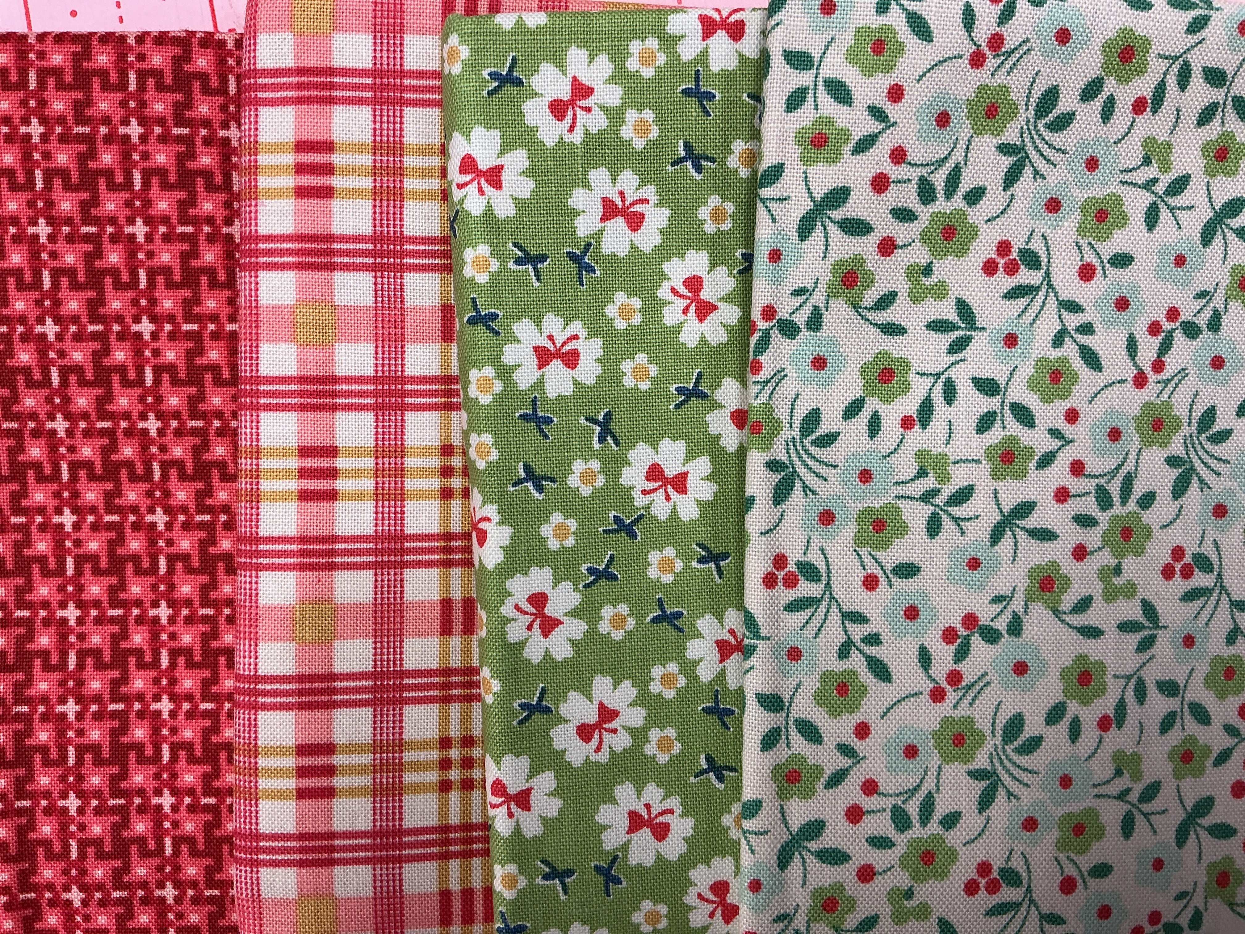 4 Yard Quilt Bundle with red and green floral and plaid fabric pieces for quilting projects